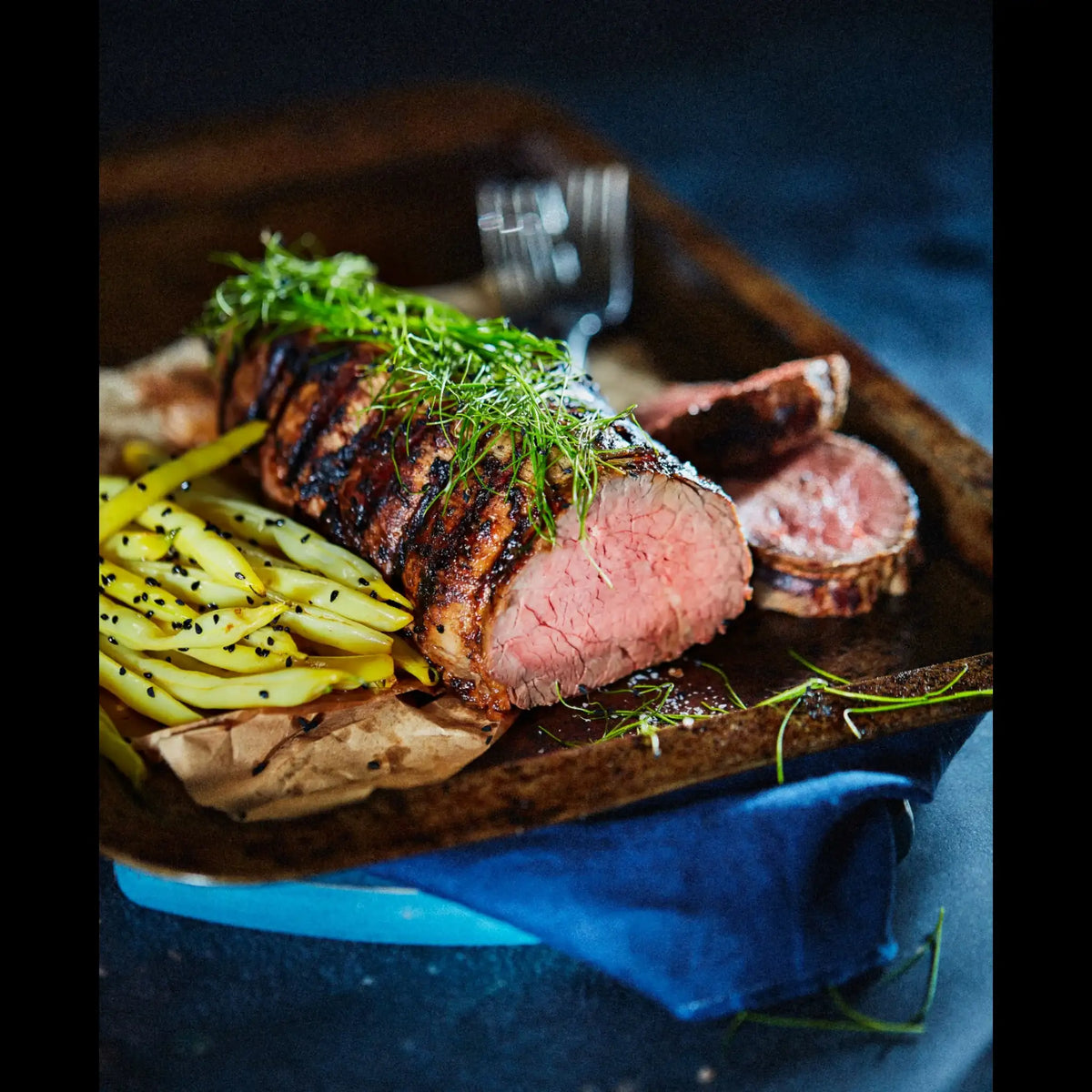 Grilled Australian beef tenderloin topped with fresh herbs, served with yellow beans, premium cut