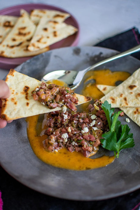 Australian Wagyu beef tartare with flatbread, herbs, and sauce from Peter Augustus Craft Butcher