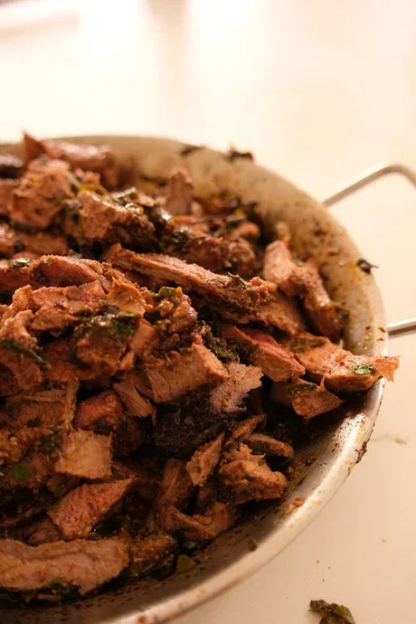 Oven-baked lamb shawarma slices in a metal pan, premium Australian lamb by Peter Augustus