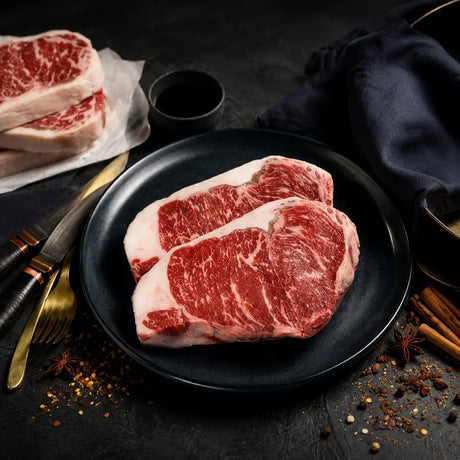 Premium Australian Wagyu striploin steak with rich marbling on a plate, Peter Augustus