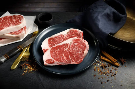 Premium Australian Wagyu striploin steak with rich marbling on a plate, Peter Augustus