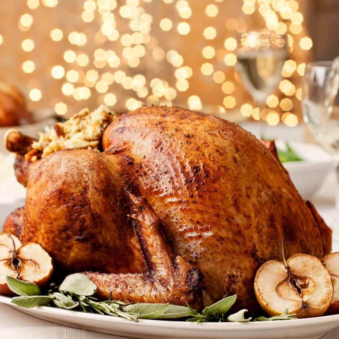 Roast turkey with stuffing and herbs on a festive table, Peter Augustus premium meat
