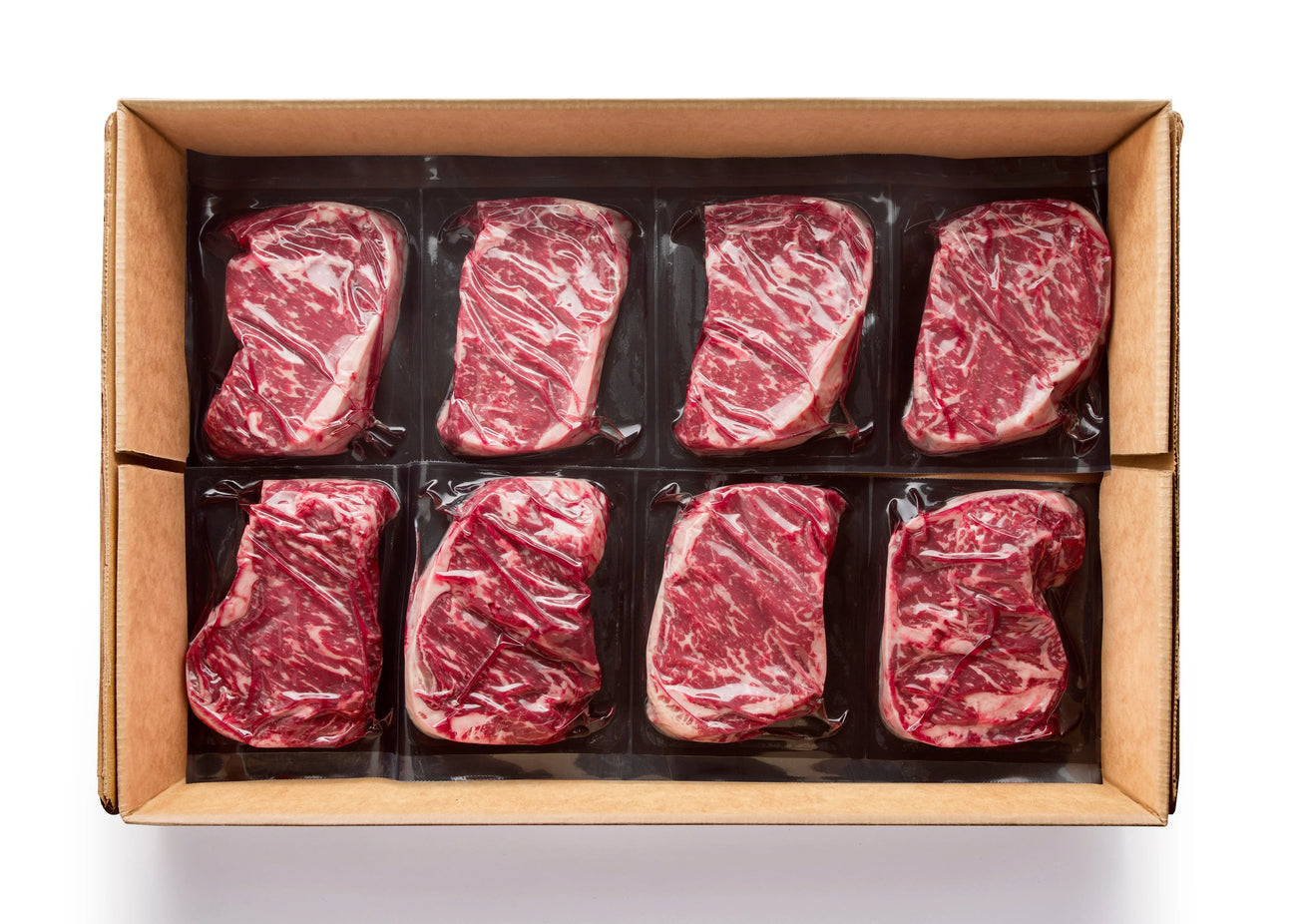 Box of premium Australian Wagyu striploin steaks from Peter Augustus, vacuum-sealed and marbled.