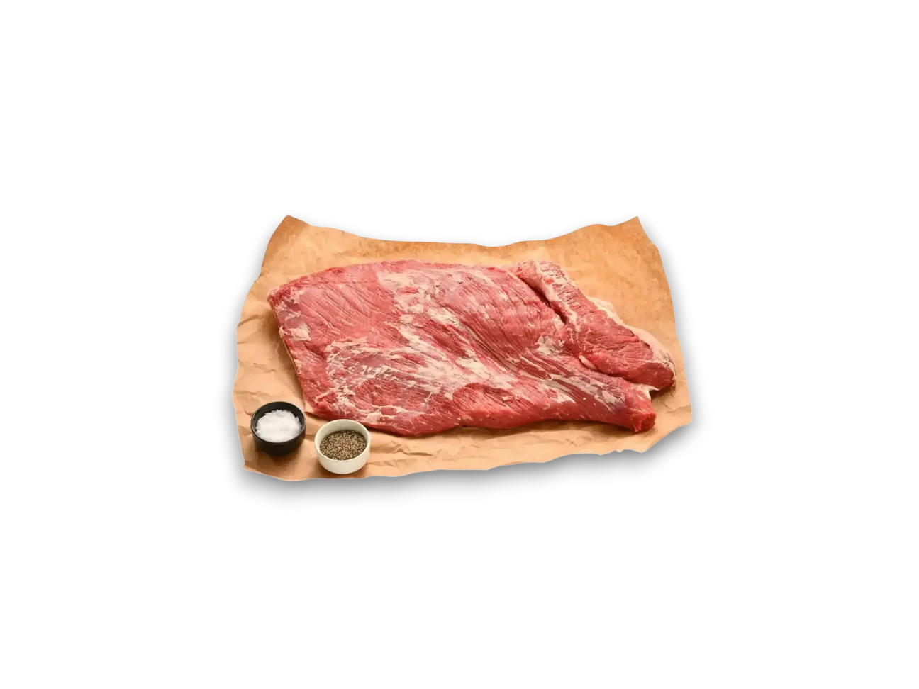 Raw Angus brisket whole cut on butcher paper with dishes of salt and pepper on white background