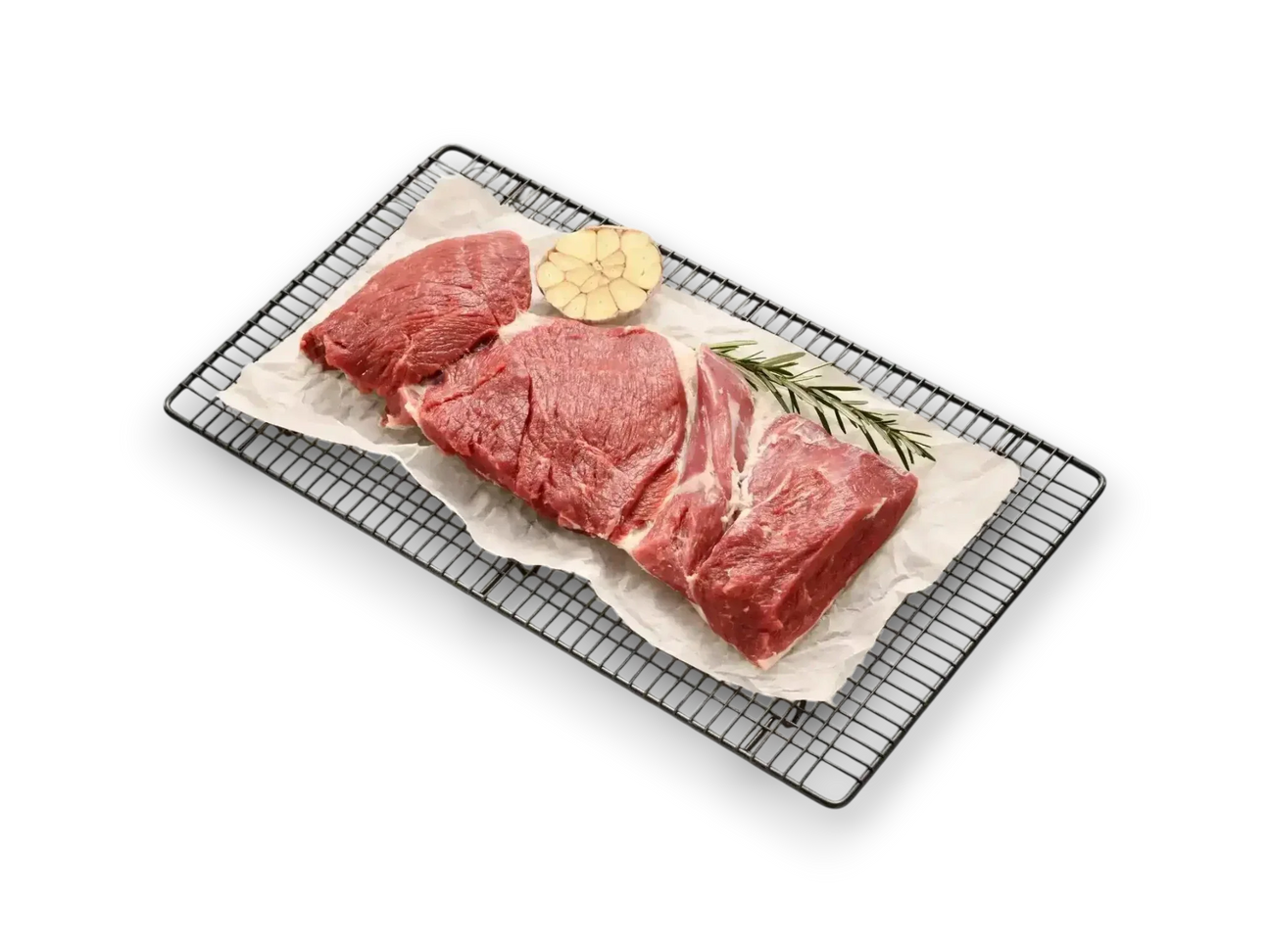 Raw lamb leg butterfly cut on baking rack with garlic and rosemary, ideal for roasting or grilling