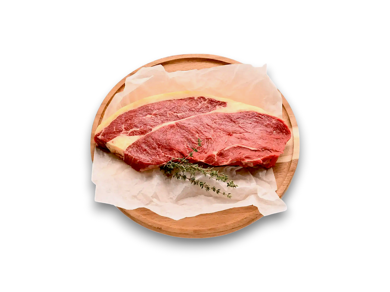 Two raw grass-fed eye fillet steaks on butcher paper with salt on a white plate