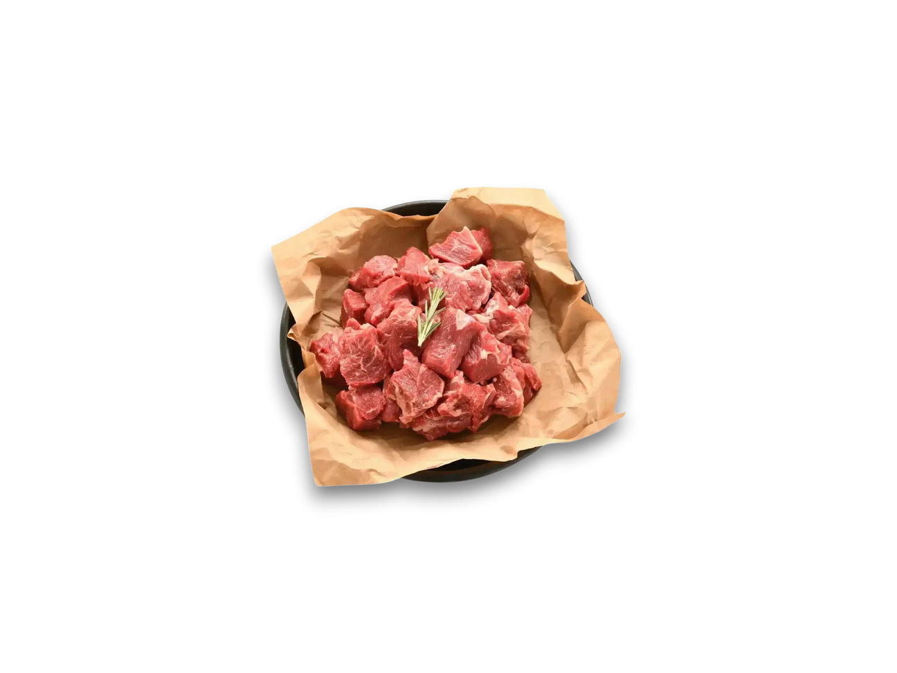 Fresh Wagyu diced beef cubes on brown paper in a bowl, garnished with rosemary