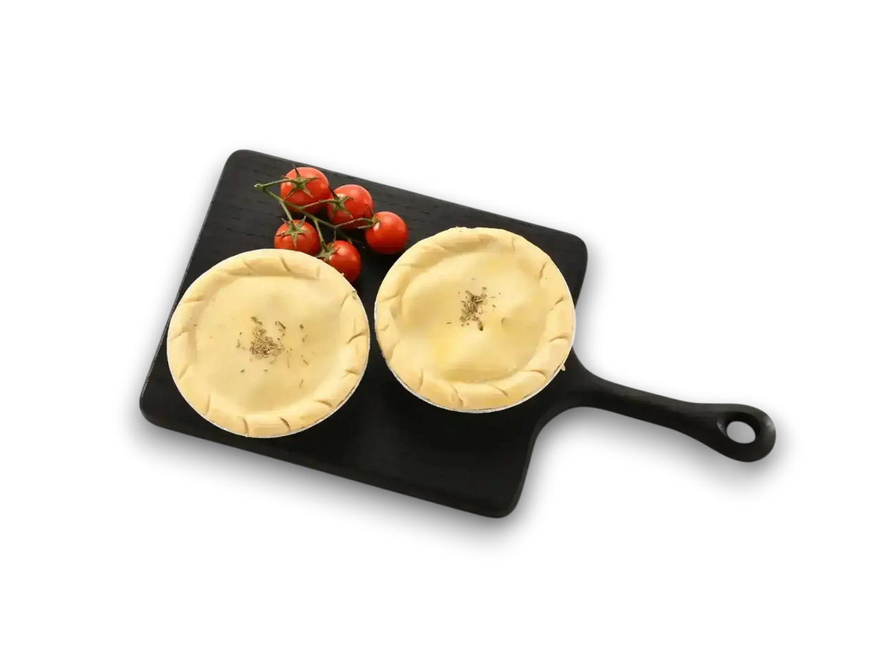 Peter Augustus chicken and bacon pies on black board with vine tomatoes