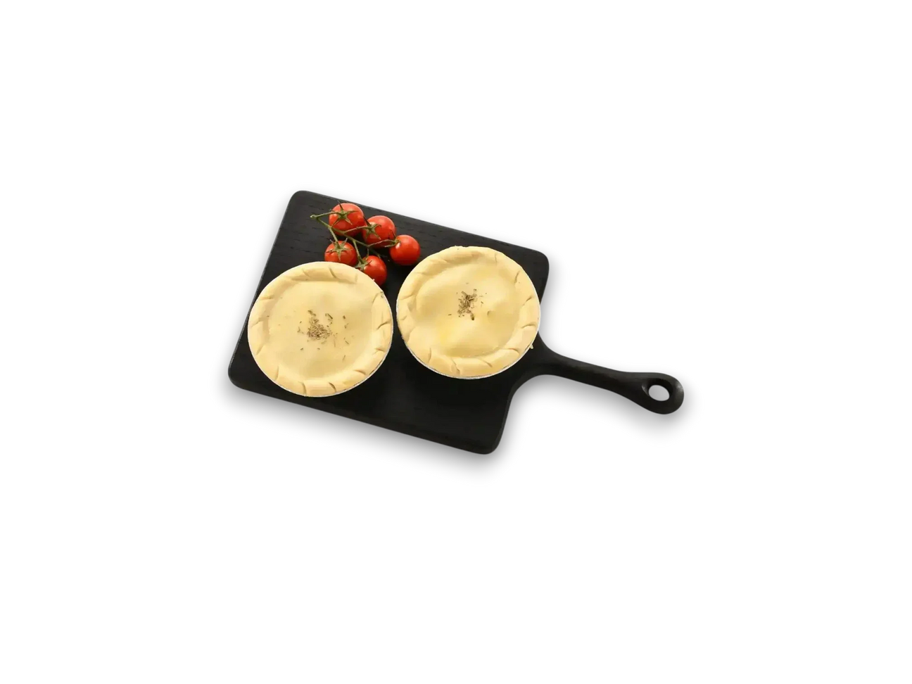 Peter Augustus chicken and bacon pies on black board with vine tomatoes
