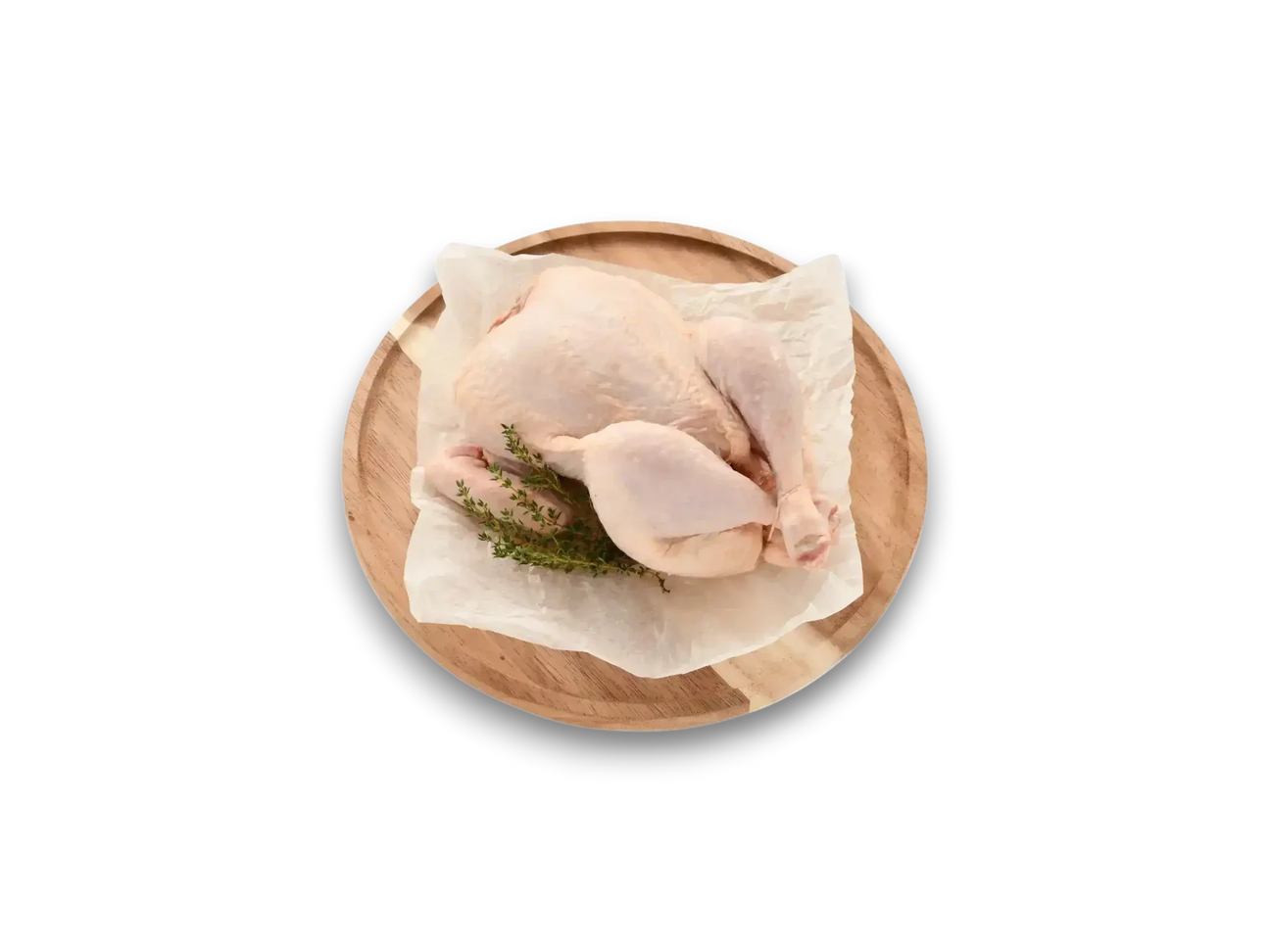 Peter Augustus free range whole chicken raw on parchment paper with fresh herbs, butcher quality