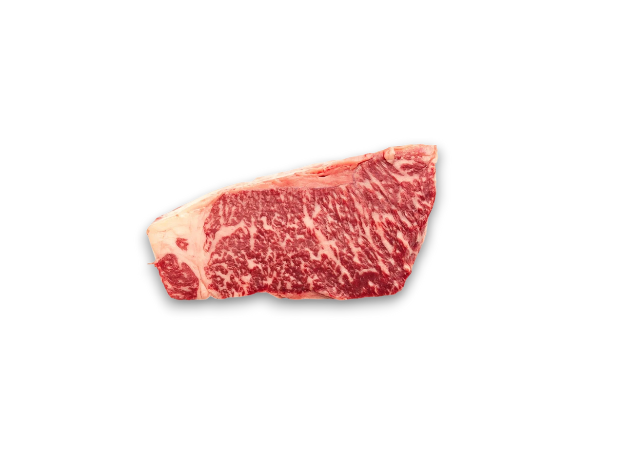 Marbled raw beef steak on a white marble surface
