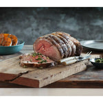 Sliced Australian roast beef with herbs from Peter Augustus Craft Butcher on wooden board