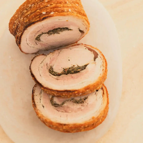 Sliced rolled roast pork with crispy crackling and herb stuffing from Peter Augustus Craft Butcher