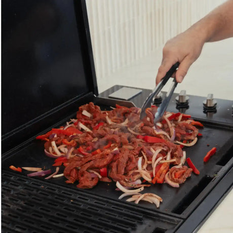 Grilling Australian beef strips with red onion and capsicum on barbecue, Peter Augustus Craft Butcher