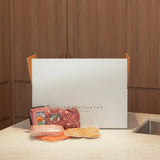 Peter Augustus premium beef and gourmet sausages in front of branded delivery box