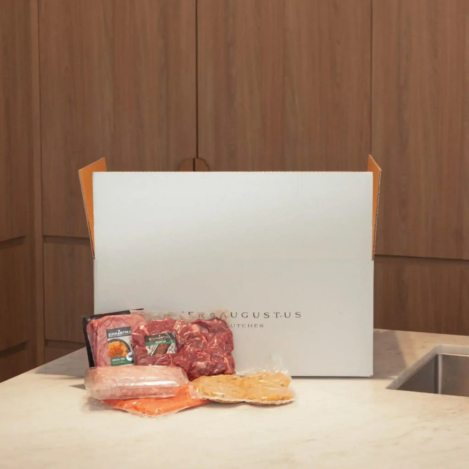 Peter Augustus premium beef and gourmet sausages in front of branded delivery box