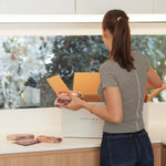 Woman unpacking premium Australian beef from Peter Augustus Craft Butcher delivery box