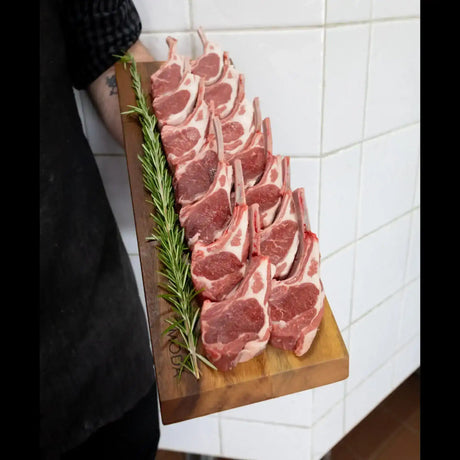 Premium lamb cutlets on wooden board with rosemary, Peter Augustus Craft Butcher selection