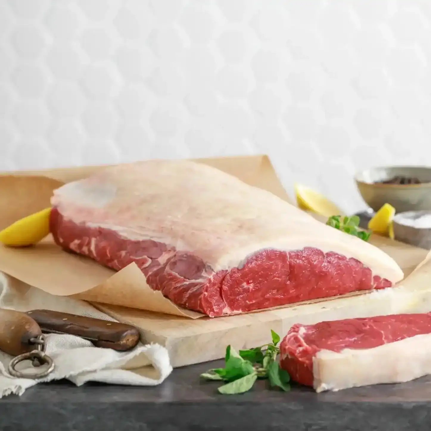 Whole Angus striploin beef cut on brown butcher paper, Peter Augustus Craft Butcher