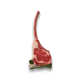 Raw ribeye steak on a white background