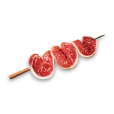 Three slices of black onyx beef on wooden skewers