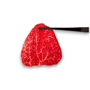 Red marbled steak with a black knife 