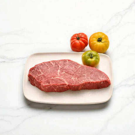 Black Onyx center cut rump steak on plate with heirloom tomatoes, Peter Augustus