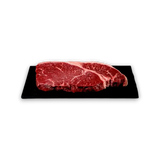 Premium marbled beef steak on black slate, fresh grass-fed Australian beef cut