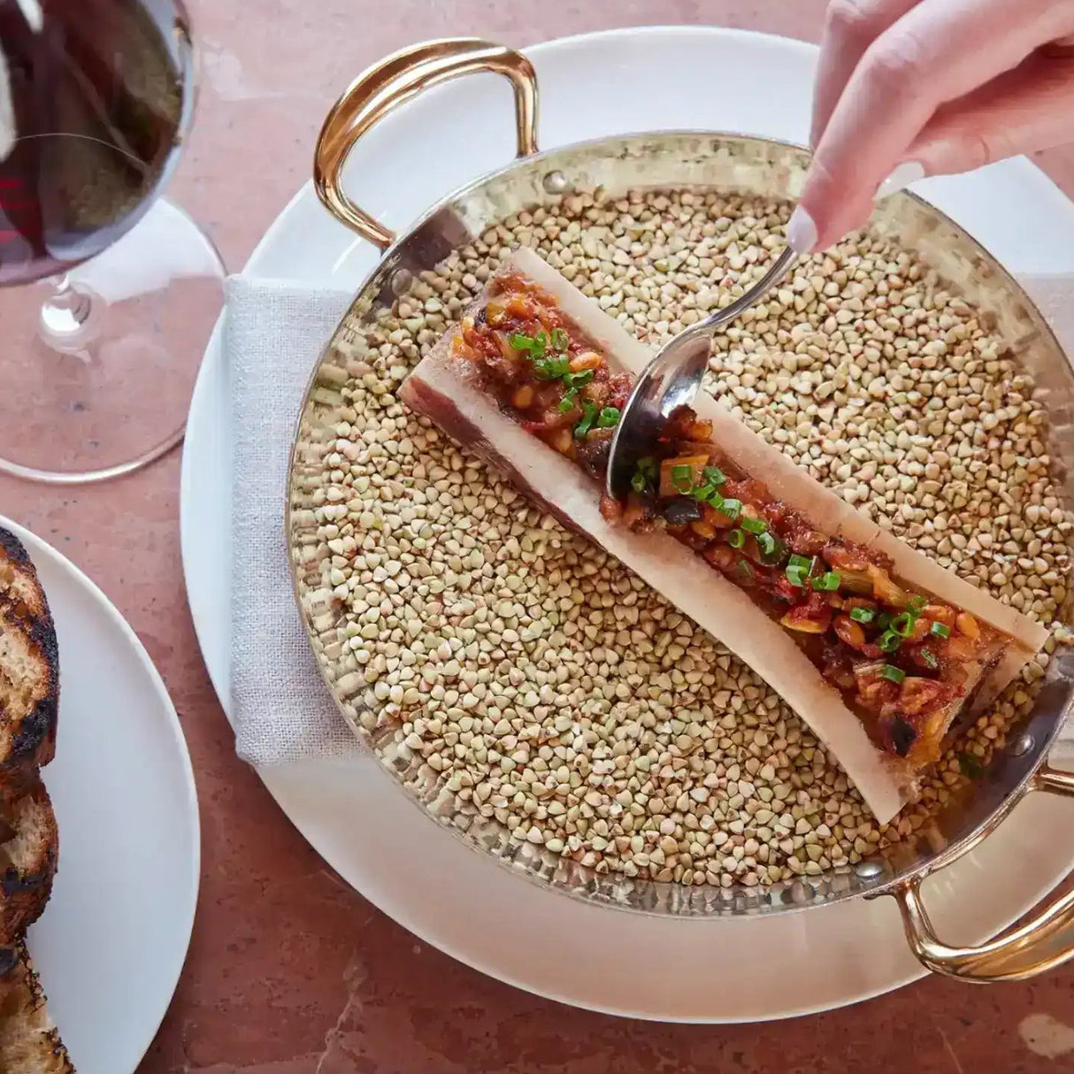 Roasted bone marrow with herbs and toasted bread, gourmet beef dish from Peter Augustus