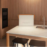 Peter Augustus Craft Butcher delivery box on counter near sink, modern wood cabinets