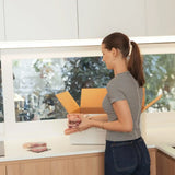 Woman unpacking premium Australian beef steaks from Peter Augustus Craft Butcher delivery box