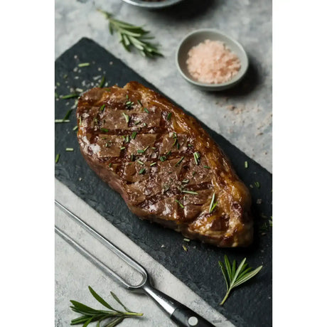 Grilled Diamantina Angus rump steak on slate with rosemary and pink salt from Peter Augustus