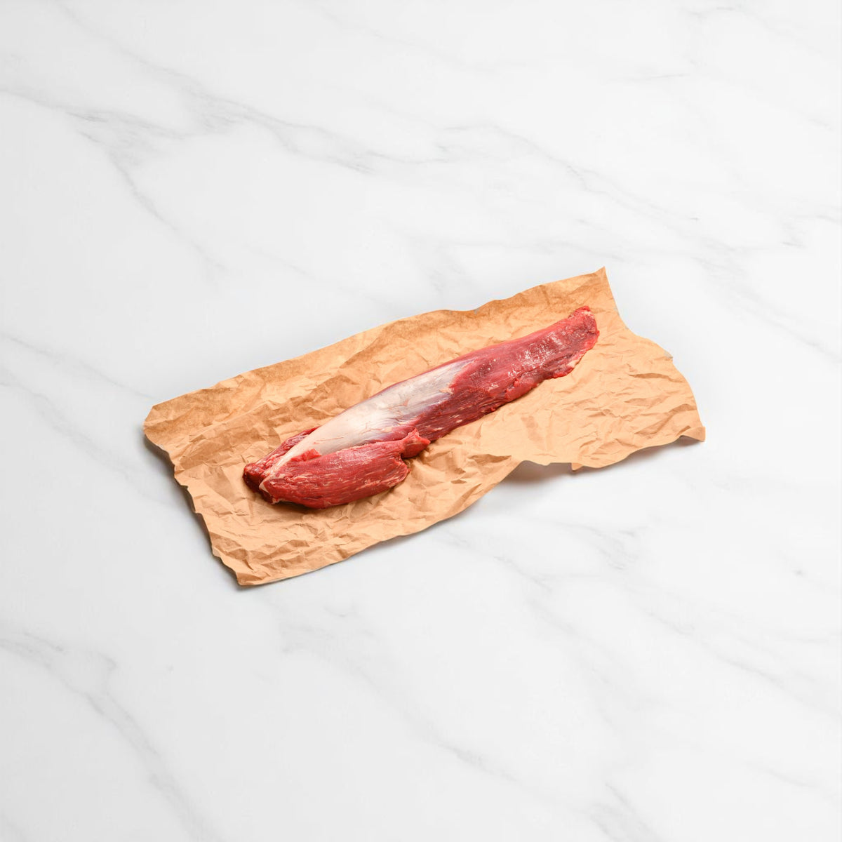 Whole Diamantina Angus eye fillet, trimmed and vacuum-sealed, showing its natural lean shape and deep red colour.