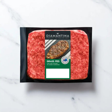 Grass fed Australian beef mince in vacuum packaging on a white marble background
