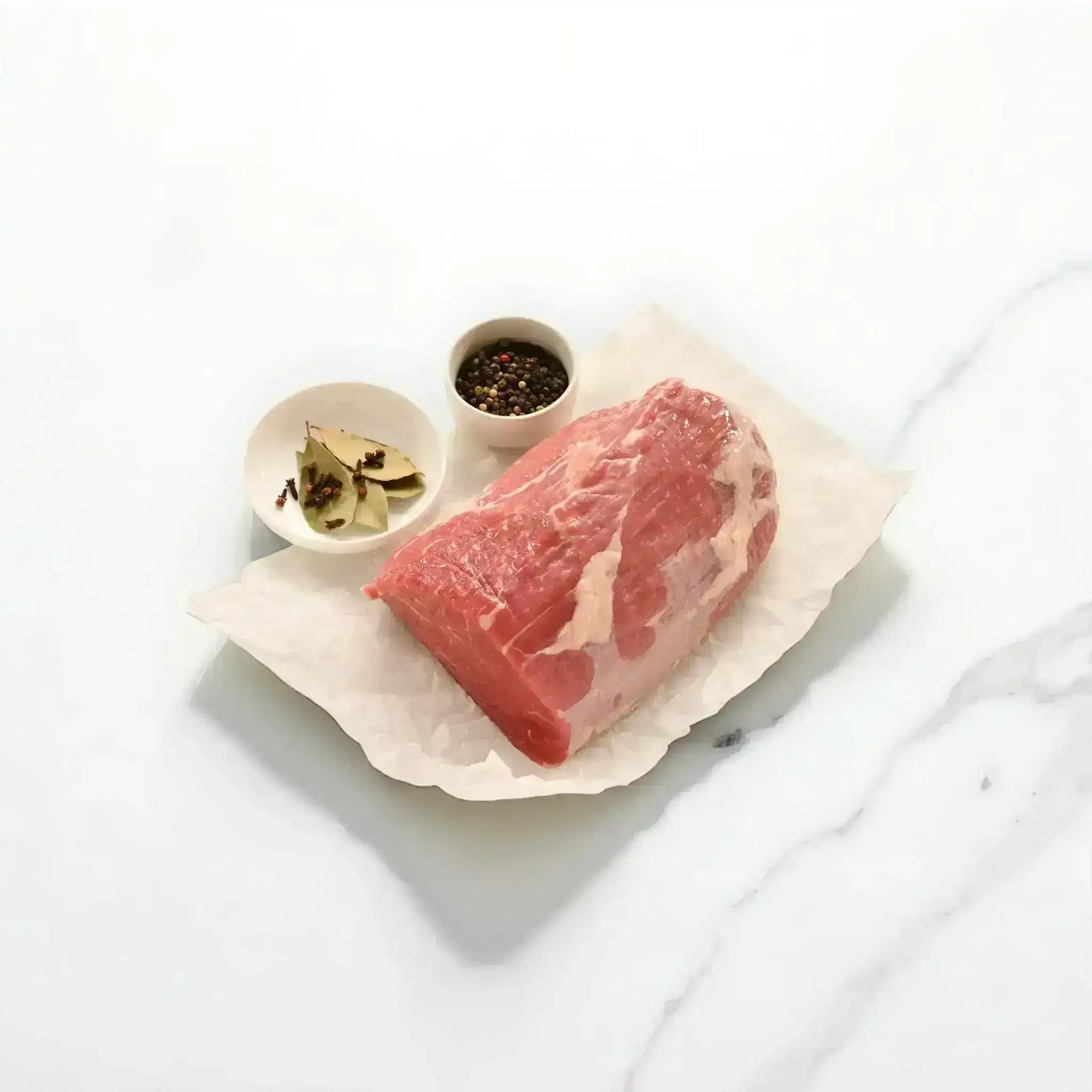 Diamantina Wagyu corned silverside raw beef cut with bay leaves and peppercorns