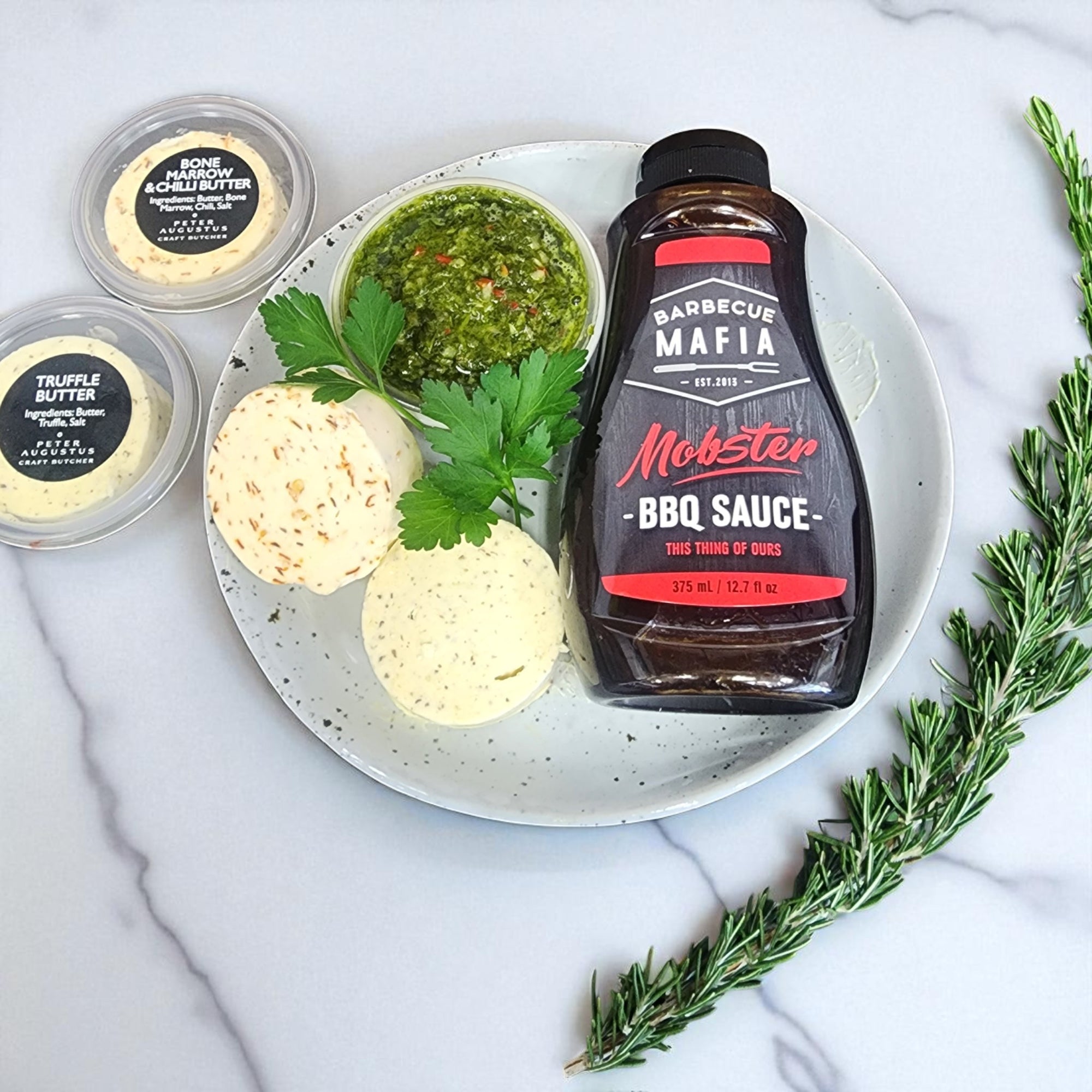 Peter Augustus Gourmet Condiment Pack with truffle butter, bone marrow & chilli butter, chimichurri and BBQ sauce, ideal for steaks and BBQs.
