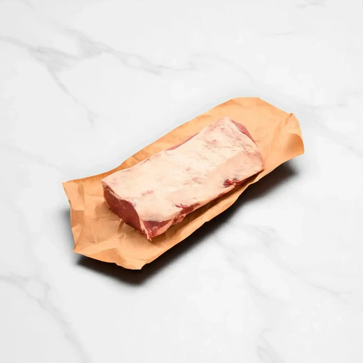 Whole grain-fed striploin on butcher paper from Peter Augustus Australian beef