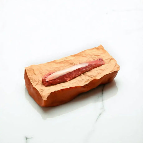 Whole grass-fed eye fillet beef on butcher paper, premium cut by Peter Augustus Craft Butcher
