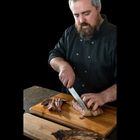 Craft butcher slicing premium Australian beef on a wooden board from Peter Augustus