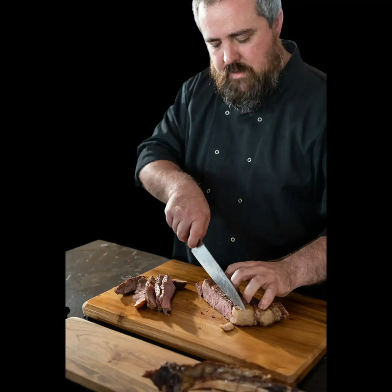 Craft butcher slicing premium Australian beef on a wooden board from Peter Augustus