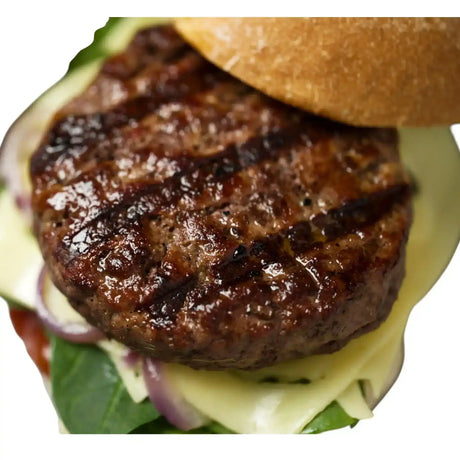 Juicy Angus beef burger with melted cheese, onions, and fresh greens on a bun