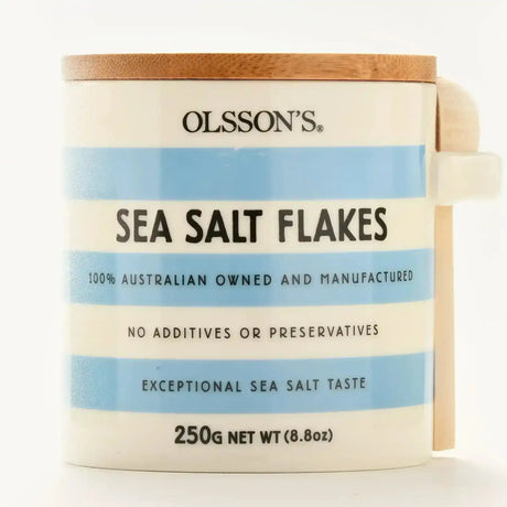 Olsson's sea salt flakes in a striped stoneware jar with wooden lid and spoon, 250g