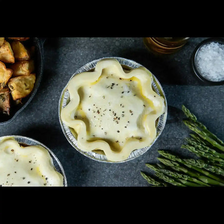 Artisan Australian beef pie by Peter Augustus Craft Butcher, topped with mashed potato and pepper.