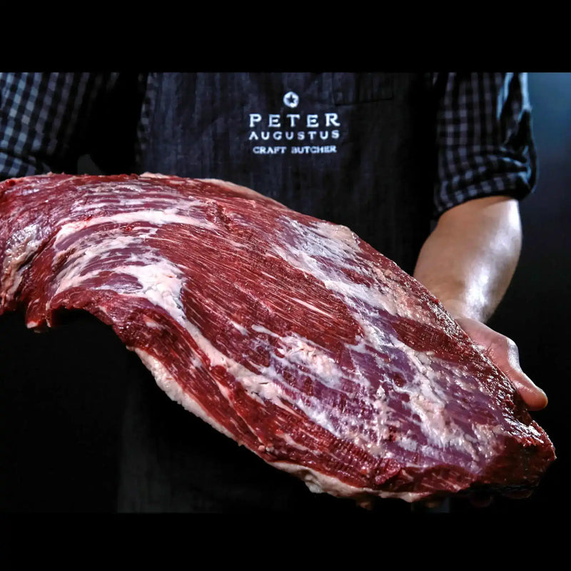 Peter Augustus Craft Butcher holding premium Australian beef brisket cut