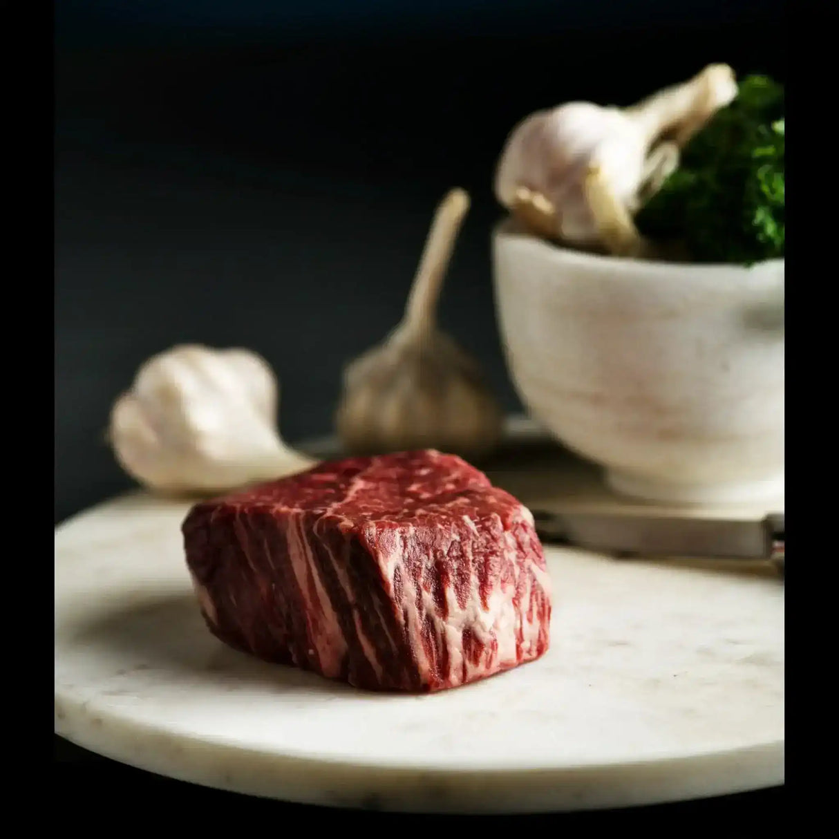 Premium Australian Wagyu eye fillet steak by Peter Augustus, marbled, with garlic and parsley