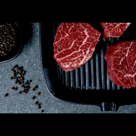 Premium Wagyu eye fillet steaks on grill pan with cracked pepper, Peter Augustus craft butcher beef