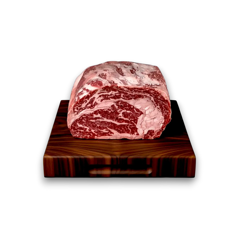 Marbled raw beef on a wooden cutting board with a white background
