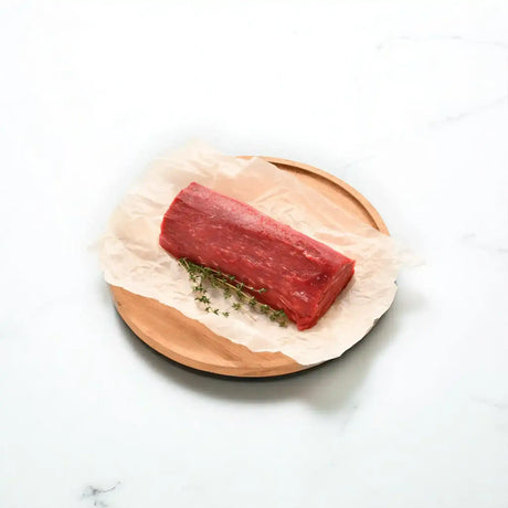 Peter Augustus Angus Eye Fillet Chateaubriand on parchment with fresh herbs