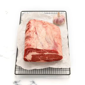 Premium Angus rib fillet steak from Peter Augustus Craft Butcher with garlic on parchment