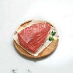 Premium Angus rump cap beef cut on parchment paper with parsley, Peter Augustus Craft Butcher